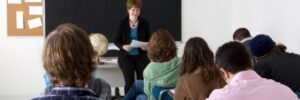 woman standing in front of a class