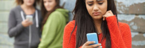 girl staring at her phone