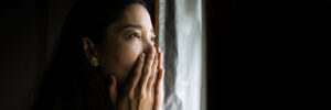 woman covering her mouth