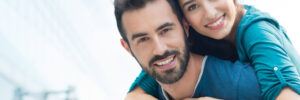man and woman smiling