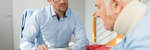 man talking with injured older male