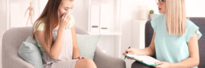 crying woman talking with therapist
