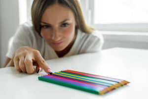 woman with OCD organizing pencils
