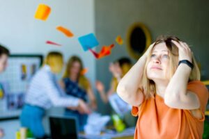 anxious woman having a panic attack at work