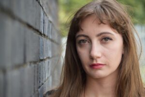 serious and sad looking woman with cold expression on her face