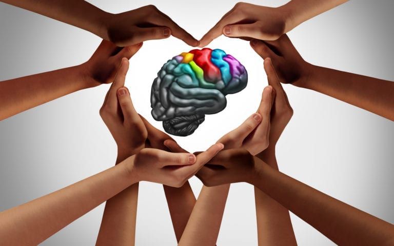 Autism brain in circle of hands