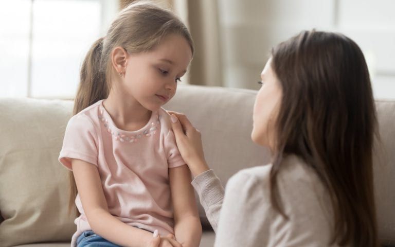 Mother discussing problem behavior with child