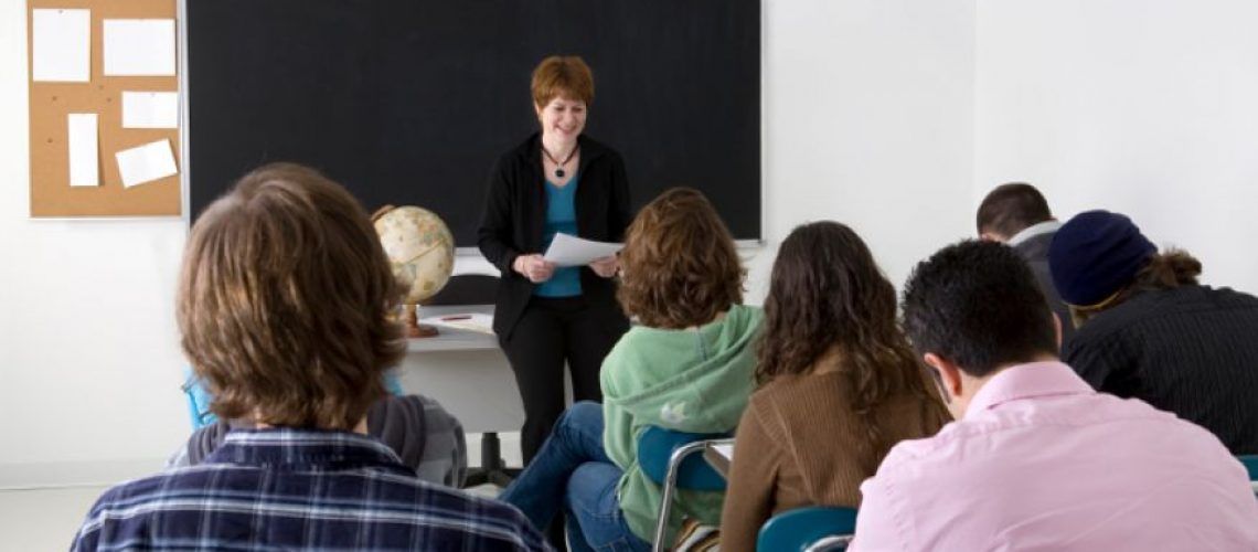 woman standing in front of a class